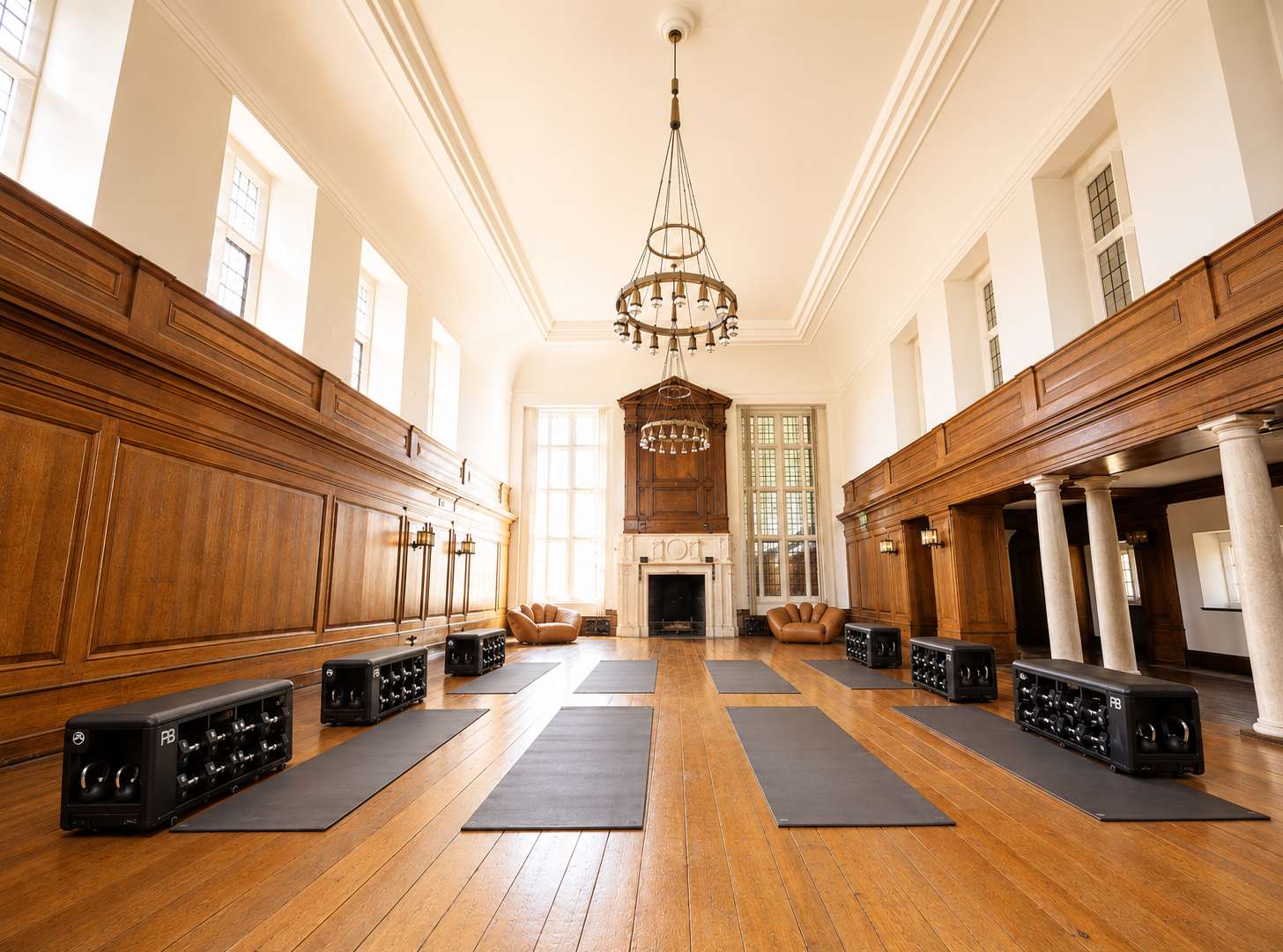 Yoga mats laid out in the wood-panelled great hall at Marshcourt