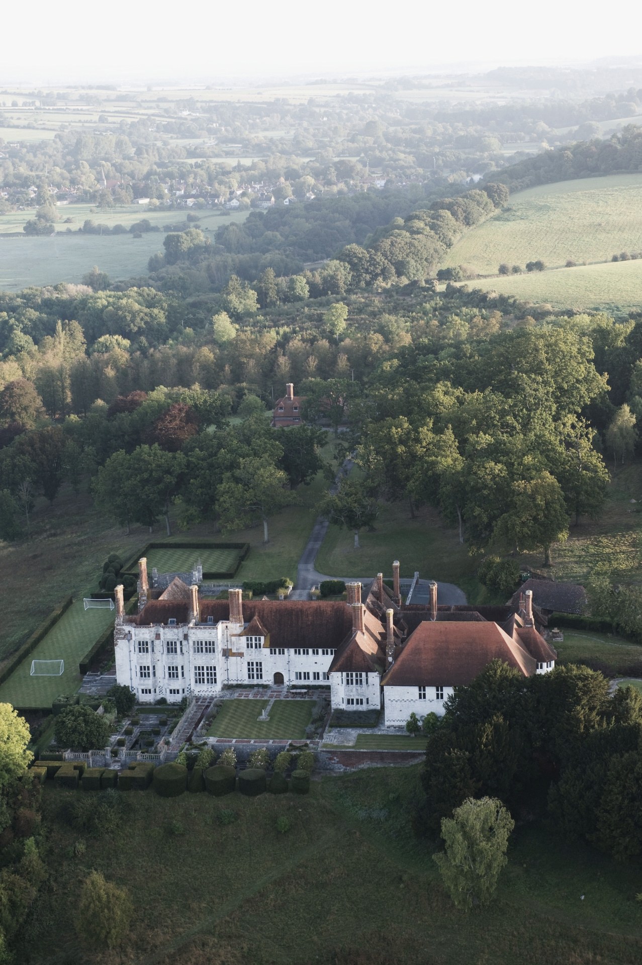 Aerial view of Marshcourt house at sunrise surrounded by Hampshire countryside